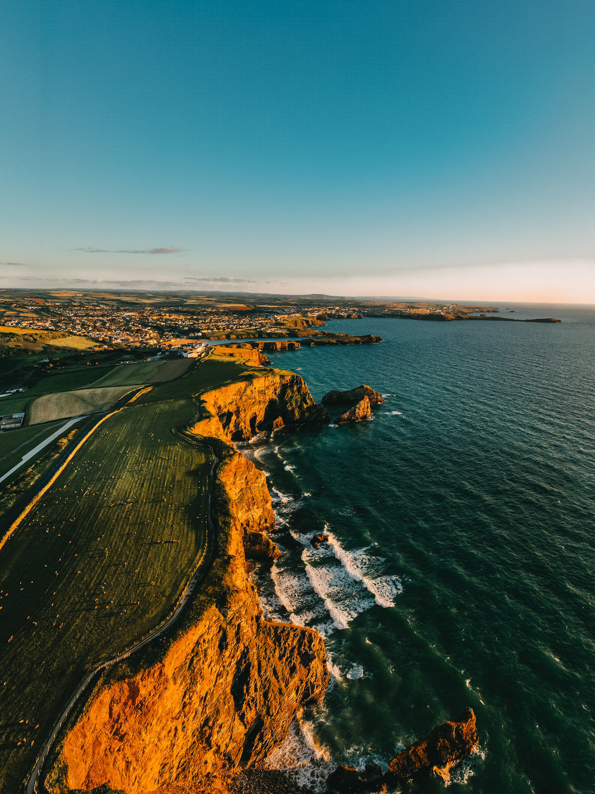 Newquay Coastline Sunset Drone Portrait - Print or in a Frame